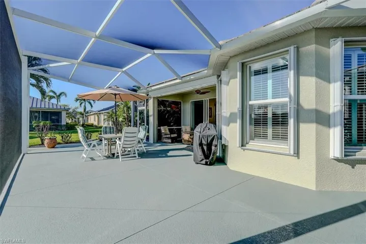 View of patio / terrace featuring outdoor dining space and glass enclosure