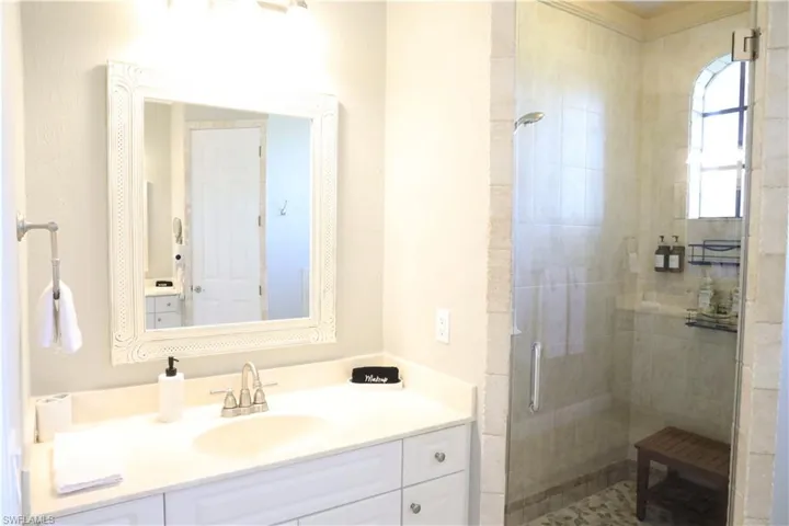 Bathroom with vanity and walk in shower