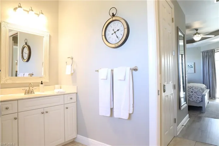 Bathroom featuring vanity and ceiling fan
