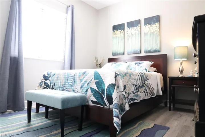 Bedroom featuring wood-type flooring