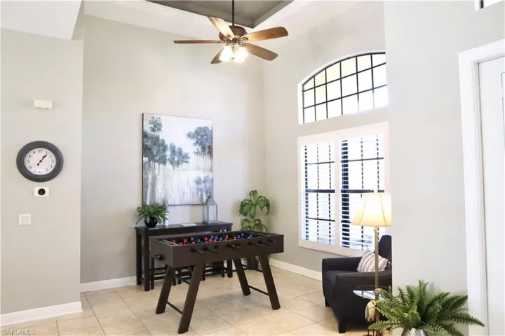 Office space with ceiling fan and light tile patterned floors