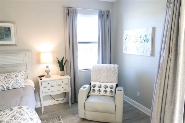 Bedroom featuring wood-type flooring