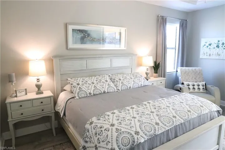 Bedroom with dark wood-type flooring