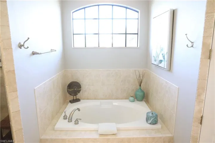 Bathroom with tiled bath