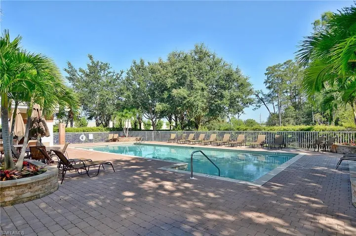 Community pool with a patio