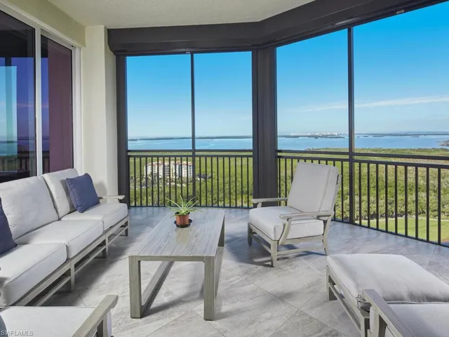 Sunroom with a water view