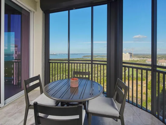Sunroom / solarium with a water view
