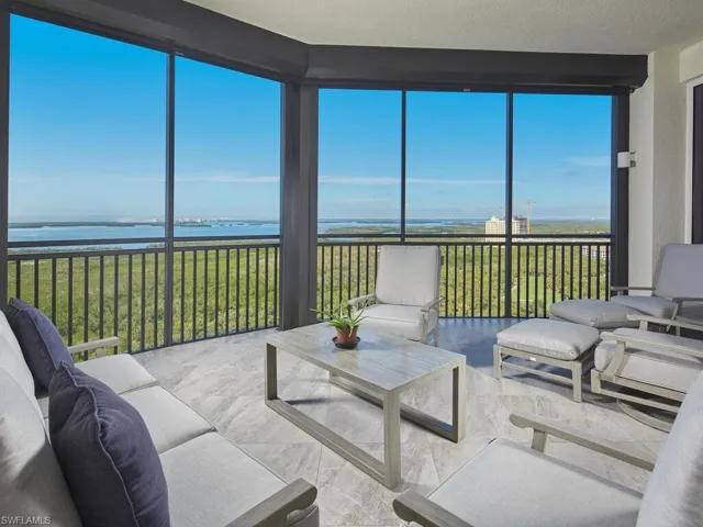 Sunroom with a water view