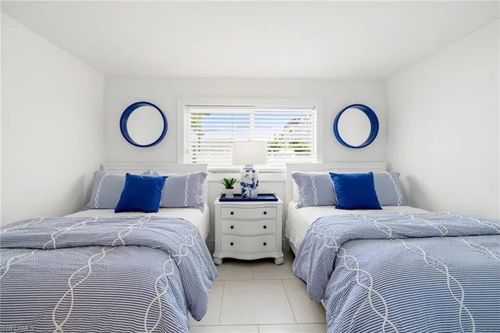 Guest Bedroom  is so welcoming dressed in Blue and White luxury bedding.