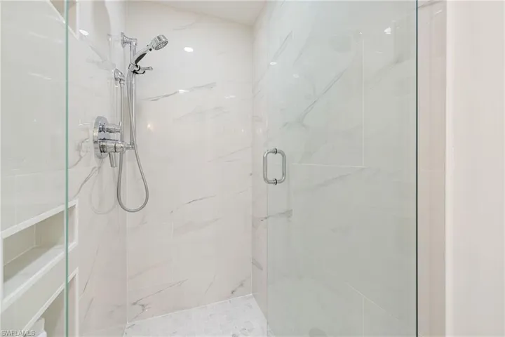 3 Niches and two shower heads in this luxurious shower