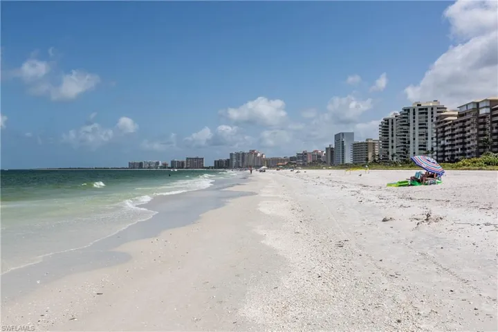 View of water feature featuring a beach view