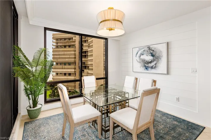 Dining area featuring crown molding and light hardwood / wood-style flooring