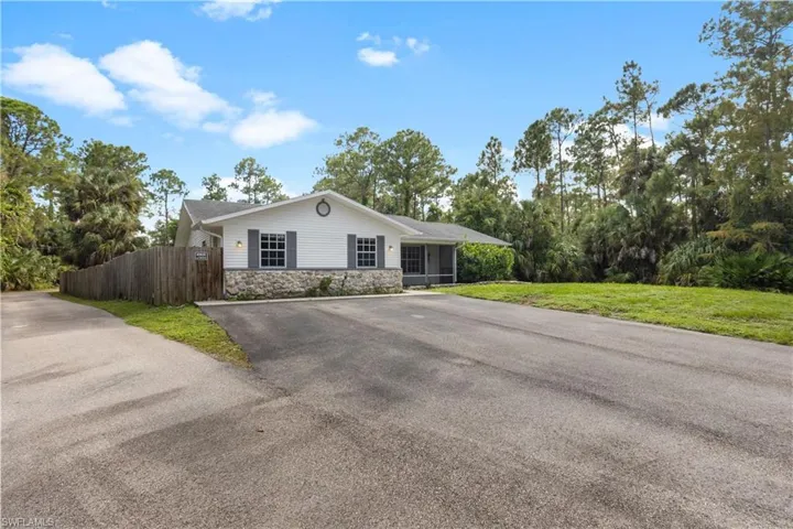 Single story home featuring a front yard