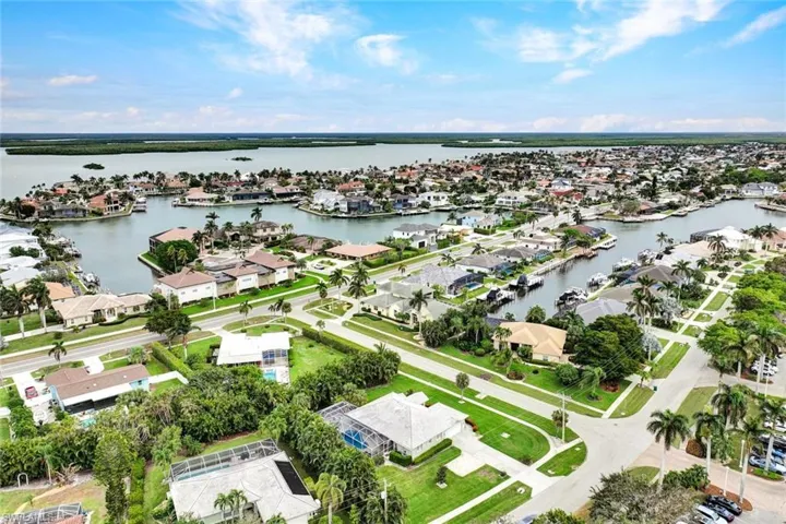 Birds eye view of property with a water view
