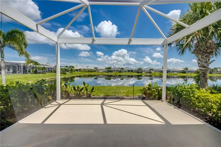Unfurnished sunroom featuring a water view