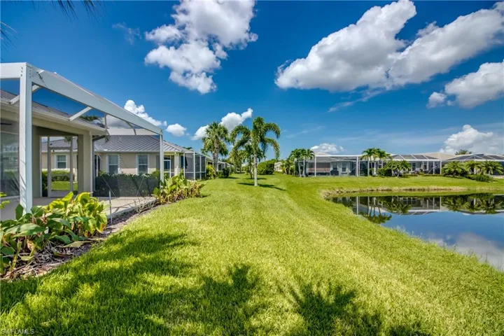 View of yard featuring a water view and a lanai