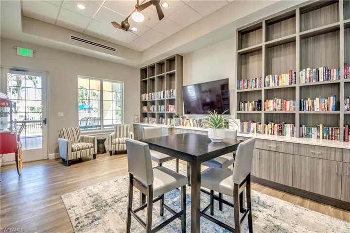 Dining room featuring ceiling fan, a paneled ceiling, and light hardwood / wood-style floors