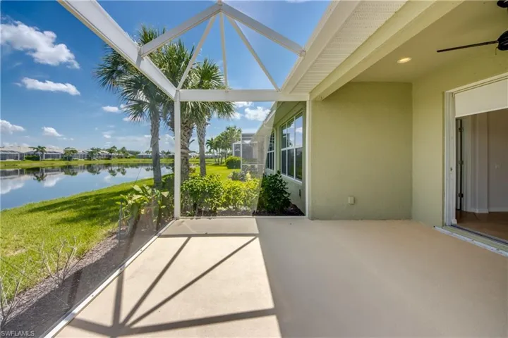 Unfurnished sunroom with a water view