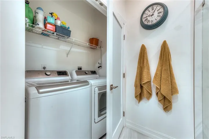Laundry is conveniently located in the primary bath