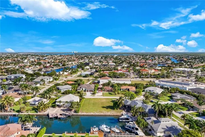 Aerial view of residential area with a nearby body of water
