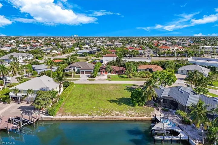 Aerial perspective of suburban area with a large body of water
