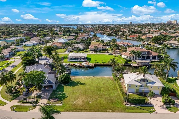 Aerial view of residential area with a nearby body of water