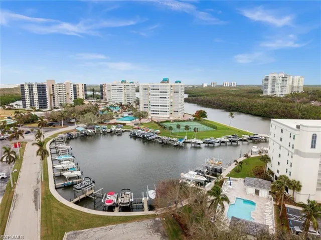 View of urban area featuring a nearby body of water and a marina