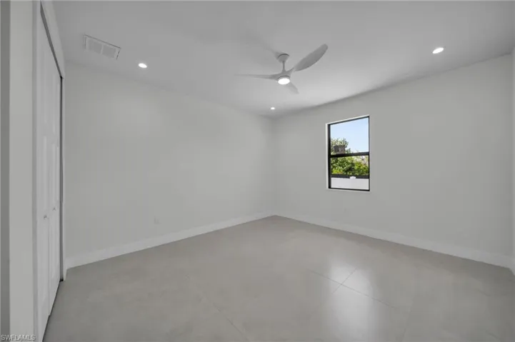 Unfurnished room featuring a ceiling fan and recessed lighting