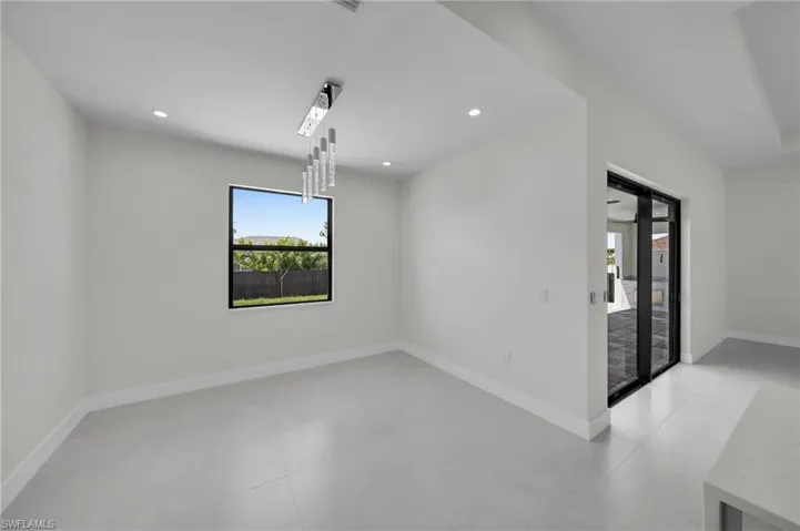 Empty room with healthy amount of natural light and recessed lighting