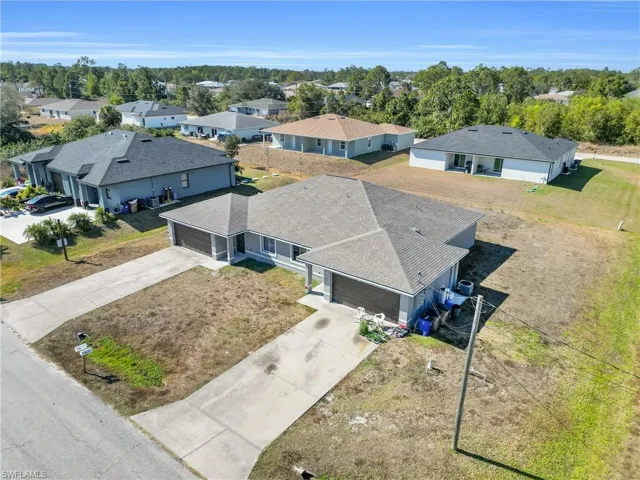 Aerial view of residential area with a tree filled landscape