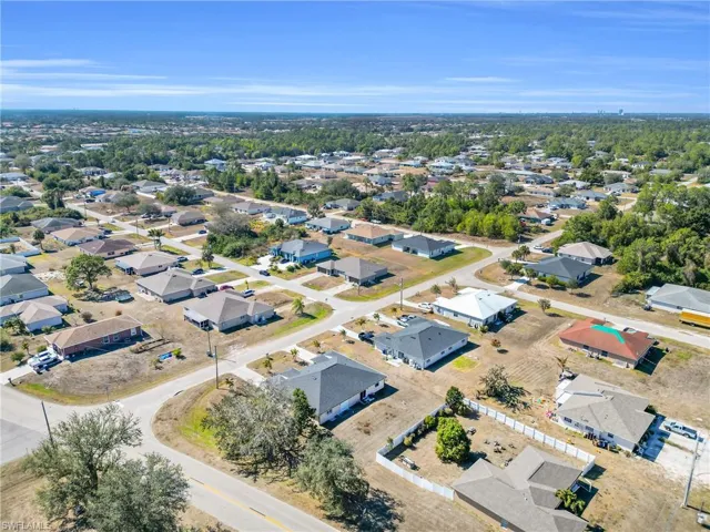 View of property location with nearby suburban area