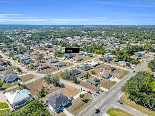 Aerial overview of property's location with nearby suburban area