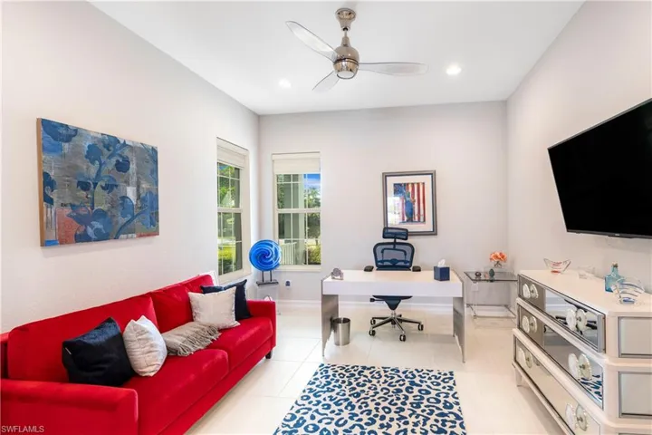 Office space with ceiling fan and light tile patterned floors