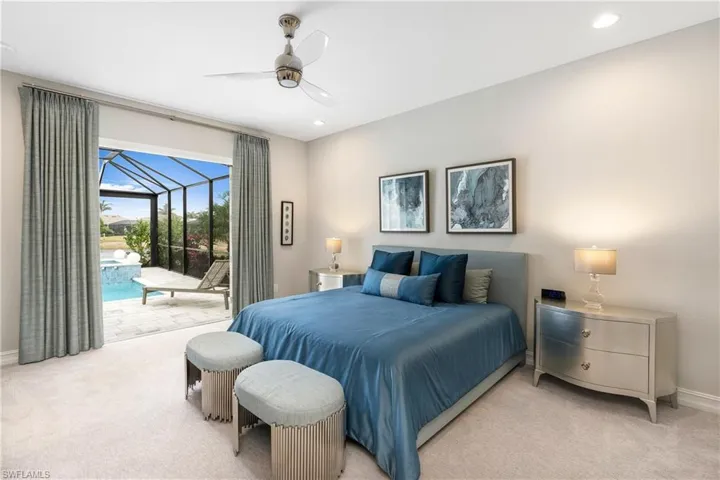 Bedroom featuring ceiling fan, access to exterior, and light carpet