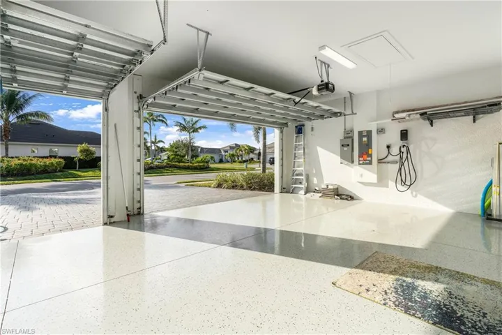 Garage featuring a garage door opener