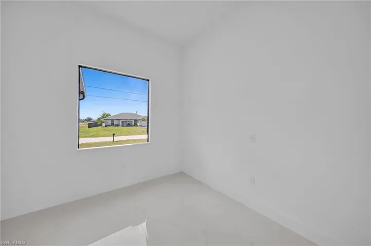 Spare room with marble finish floor