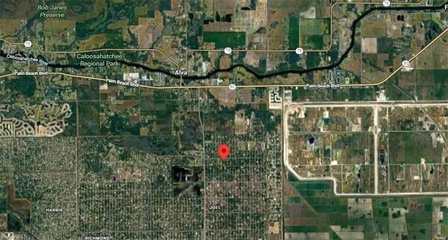 Aerial overview of property's location with property parcel outlined