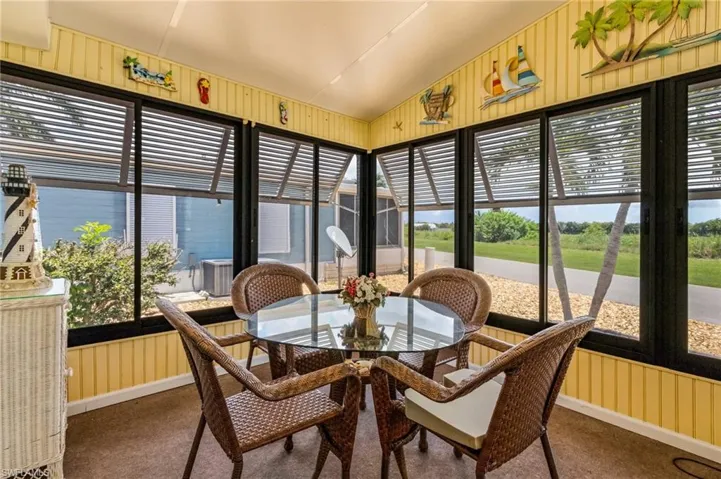 Sunroom / solarium with vaulted ceiling