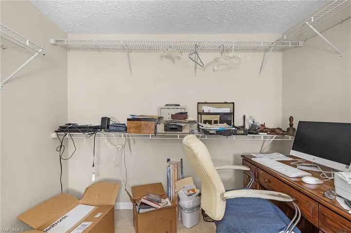 Home office featuring a textured ceiling