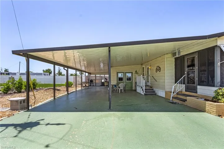View of patio / terrace with a carport