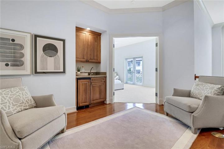 Upstairs loft area with wet bar, beverage refrigerator and seating area