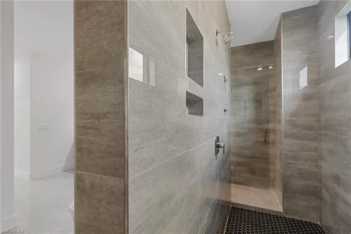 Bathroom with a tile shower