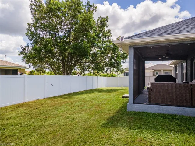 View of fenced backyard