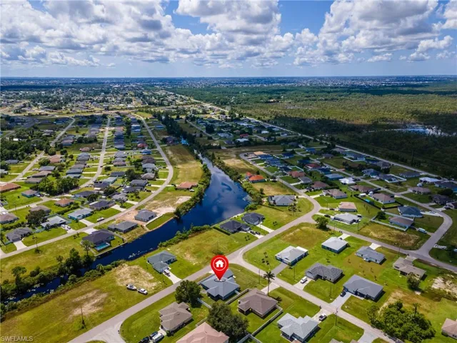 Aerial perspective of suburban area with a large body of water
