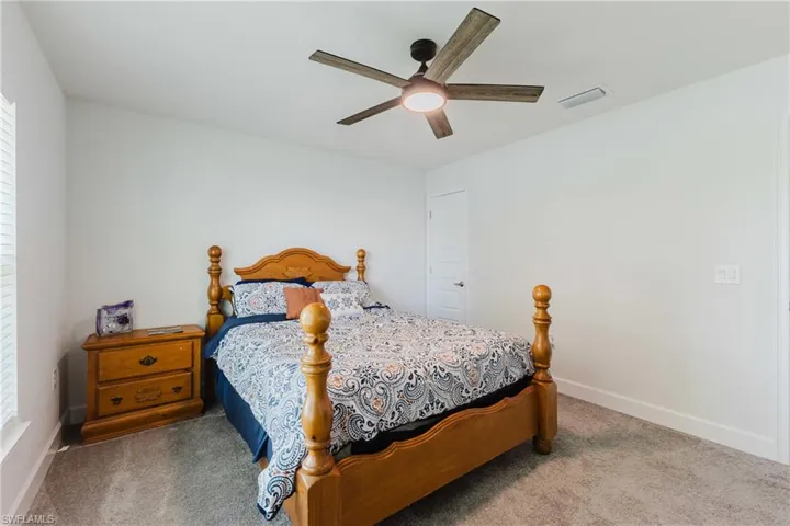 Bedroom featuring carpet flooring and a ceiling fan