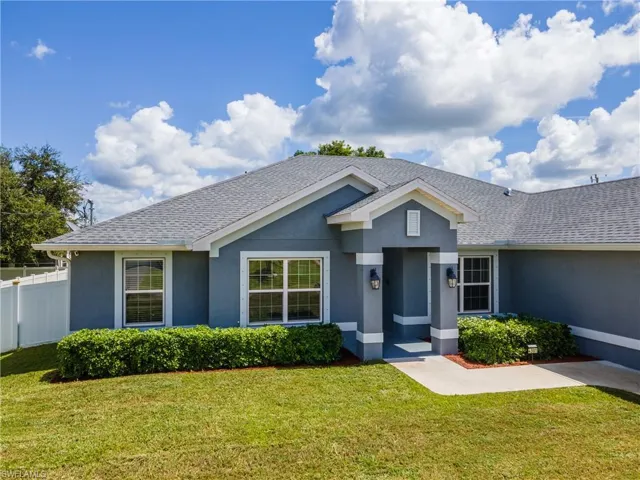 Ranch-style home featuring stucco siding and roof with shingles
