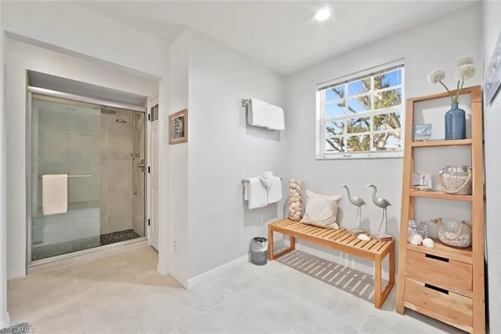 Bathroom with tile patterned flooring and walk in shower