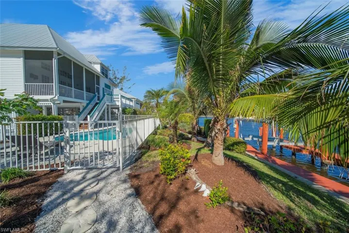 View of pool featuring a sunroom and a patio