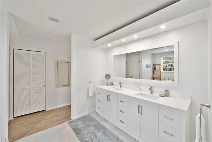Bathroom featuring hardwood / wood-style floors and vanity