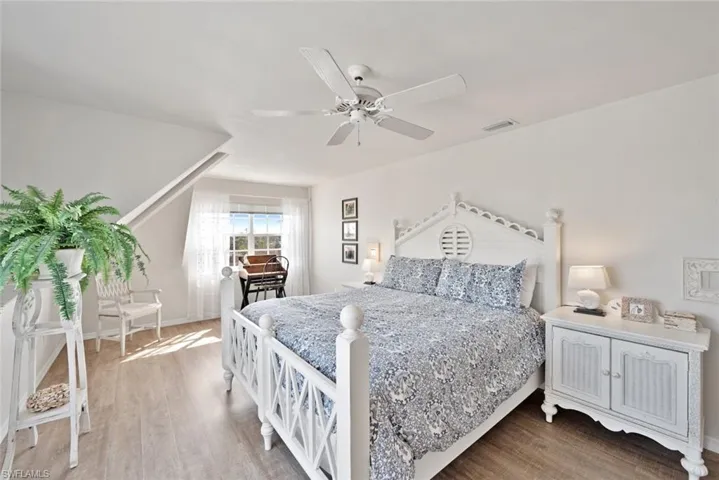 Bedroom featuring hardwood / wood-style floors and ceiling fan
